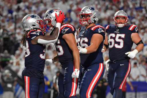 New England Patriots running back Rhamondre Stevenson, left, celebrates with teammate Hunter Henry after his touchdown against the Buffalo Bills during the second half of an NFL football game, Sunday, Sept. 5, 2025, in Orchard Park, N.Y. (AP Photo/Adrian Kraus) New England Patriots running back Rhamondre Stevenson, left, celebrates with teammate Hunter Henry after his touchdown against the Buffalo Bills during the second half of an NFL football game, Sunday, Sept. 5, 2025, in Orchard Park, N.Y. (AP Photo/Adrian Kraus)
