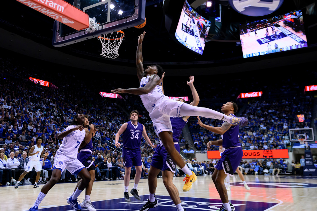 BYU forward Kennard Davis Jr. shoots the ball during the first half of an NCAA college basketball game against Holy Cross, Saturday, Nov. 8, 2025, in Provo, Utah. (AP Photo/Tyler Tate)