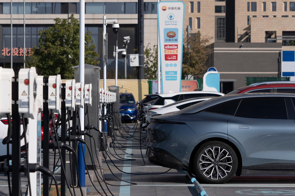 FILE - Electric vehicle charging stations are seen in Beijing, on Oct. 11, 2024. (AP Photo/Caroline, File)