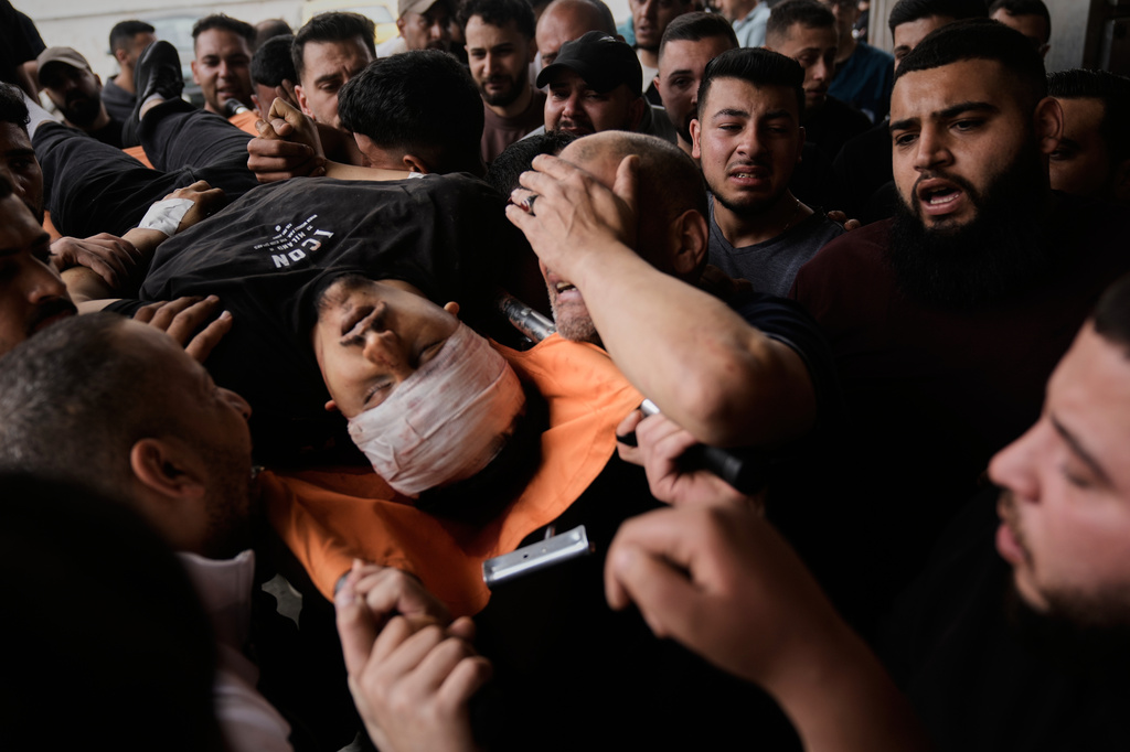 The body of Nayef Samaro, 26, who was killed in clashes with Israeli forces, is brought to Rafidia Hospital in the West Bank city of Nablus, Sunday, May 3, 2026. (AP Photo/Majdi Mohammed)