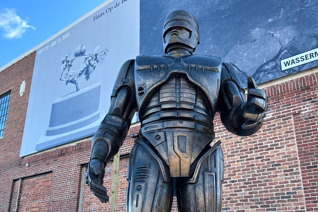 A statue of RoboCop stands outside a business in Detroit's Eastern Market area, Thursday, Dec. 4, 2025. (AP Photo/Mike Householder)