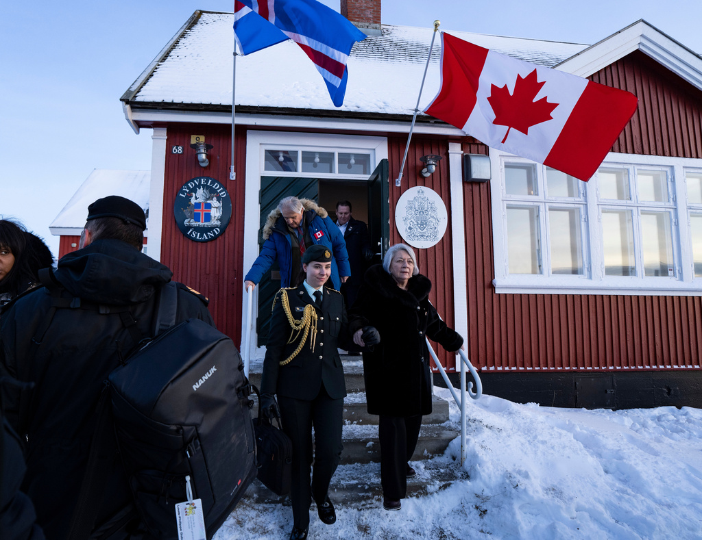 Canadian Governor General Mary Simon, right, leaves the newly opened Canadian consulate in Nuuk, Greenland, on Friday, Feb. 6, 2026. (Christinne Muschi/The Canadian Press via AP)