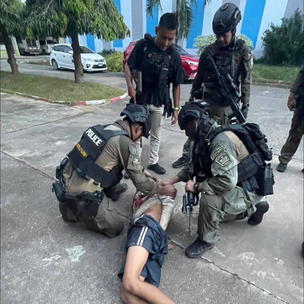This photo released by the Royal Thai Police, shows Thai police arresting a man at Patongprathankiriwat School in Hat Yai, Songkhla province, Thailand, Wednesday, Feb. 11, 2026. (Royal Thai Police via AP)