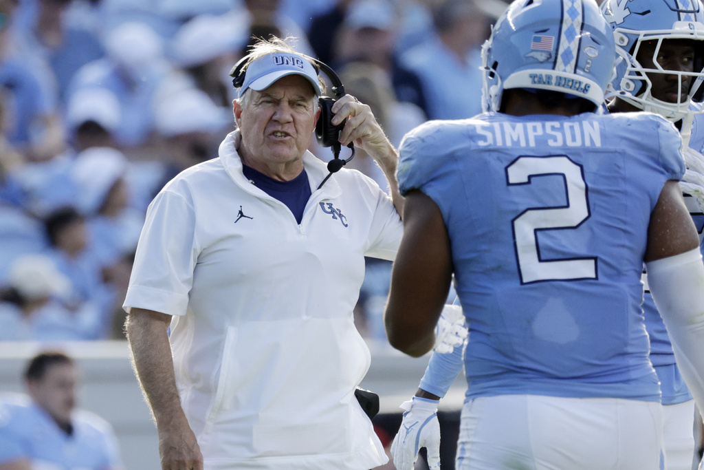 North Carolina head coach Bill Belichick talks to North Carolina linebacker Andrew Simpson (2) during the second half of an NCAA college football game against Richmond, Saturday, Sept. 13, 2025, in Chapel Hill, N.C. (AP Photo/Chris Seward)