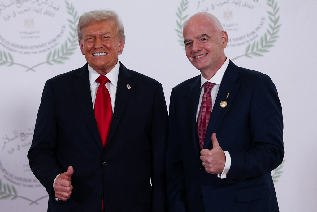 President Donald Trump and FIFA president Gianni Infantino pose for a photo in Sharm el-Sheikh, Egypt, Monday, Oct. 13, 2025. (Suzanne Plunkett, Pool Photo via AP)