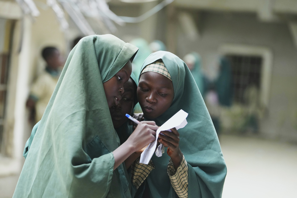 Students of the Future Prowess Islamic Foundation School study during break time, in Maiduguri, Nigeria, Thursday, July 24, 2025. (AP Photo/Sunday Alamba)