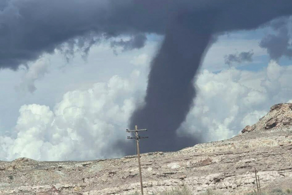 In this photo released by the Navajo Police Department, a tornado funnel is seen Sat., Sept. 13, 2025, northeast of Montezuma Creek, Utah. (Navajo Police Department via AP)