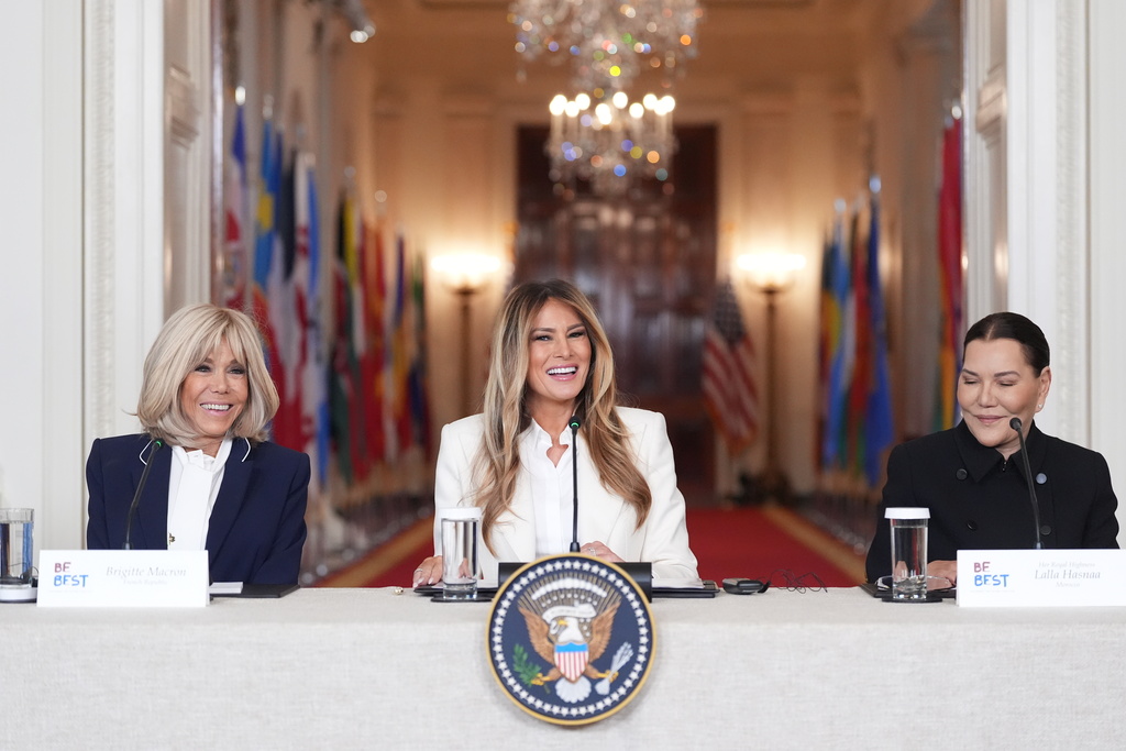 First lady Melania Trump speaks during a "Fostering the Future Together Global Coalition Summit," with Brigitte Macron, France, left, and Princess Lalla Hasnaa, Morocco, right, at the White House, Wednesday, March 25, 2026, in Washington. (AP Photo/Jacquelyn Martin)