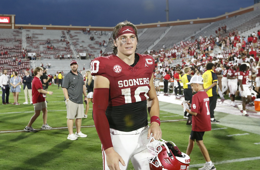 Oklahoma quarterback John Mateer walks off the field after his team defeated Illinois State during an NCAA college football game, Saturday, Aug. 30, 2025, in Norman, Okla. (AP Photo/Alonzo Adams)