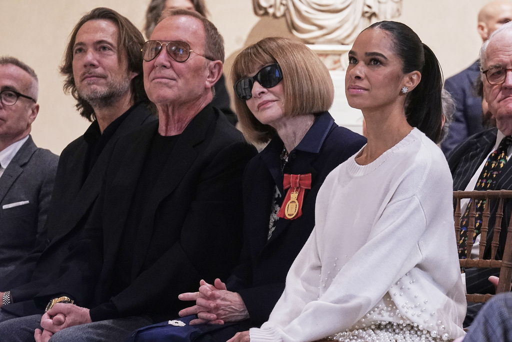 Designer Michel Kors, second left, former Vogue magazine's editor-in-chief Anna Wintour, third left, and Misty Copeland, right, who recently retired from American Ballet Theatre, listen during the announcement, at the Metropolitan Museum of Art, in New York, Monday, Nov. 17, 2025, about the next spring fashion exhibit "Costume Art," which is set to launch at the Met Gala in 2026. (AP Photo/Richard Drew)