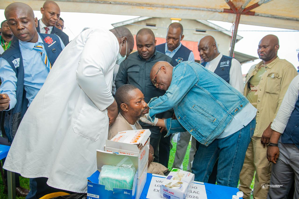 Congo’s Health Minister Roger Kamba administers an Ebola vaccine to a health care worker in Kisangani, Congo, Thursday, Aug. 27, 2026. (AP Photo/Samy Kamanga)