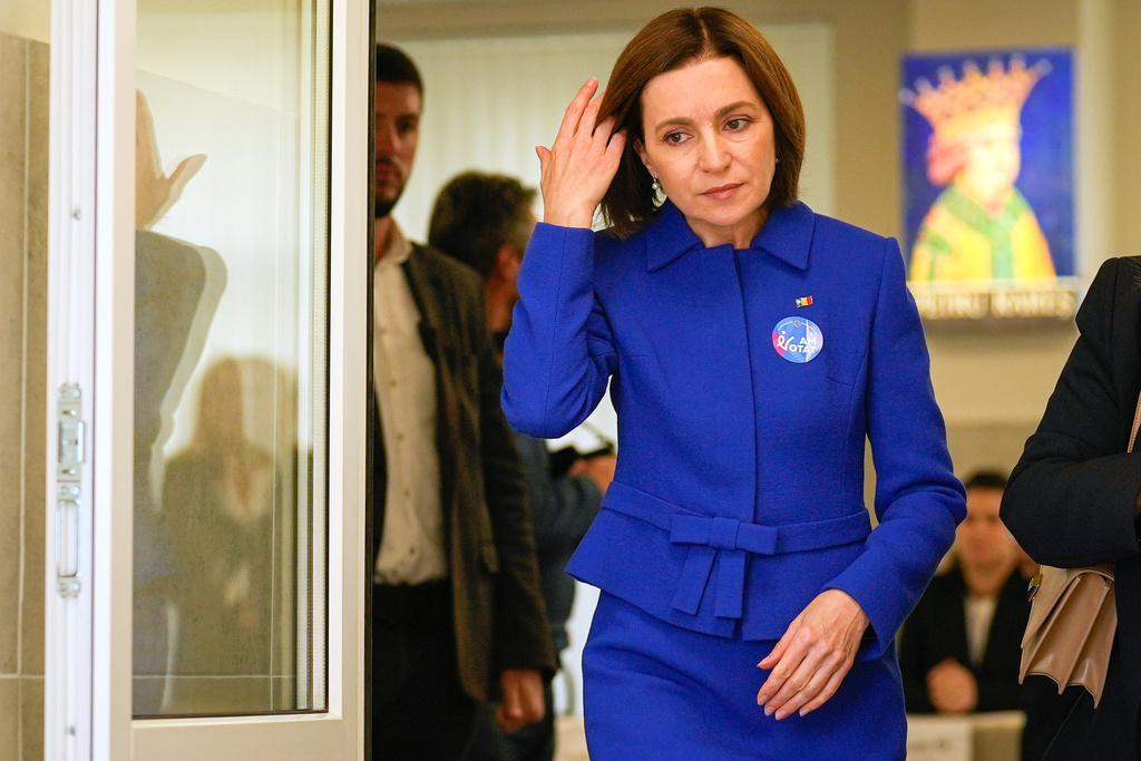 Moldova's President Maia Sandu exits a voting station after casting her vote during a parliamentary election, in Chisinau, Moldova, Sunday, Sept. 28, 2025. (AP Photo/Vadim Ghirda)