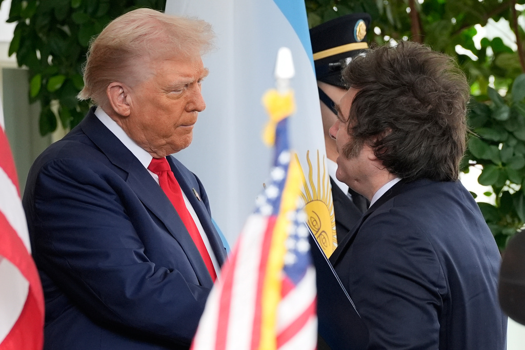 President Donald Trump greets Argentina's President Javier Milei at the White House, Tuesday, Oct. 14, 2025, in Washington. (AP Photo/Alex Brandon)