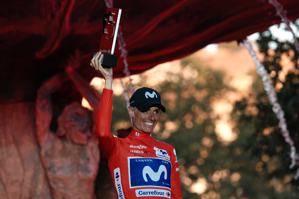 Spain's Enric Mas celebrates on the podium after winning the overall classification of the Spanish Vuelta cycling race in Granada, Spain, Sunday, Sept. 13, 2026. (AP Photo/Gregorio Marrero)