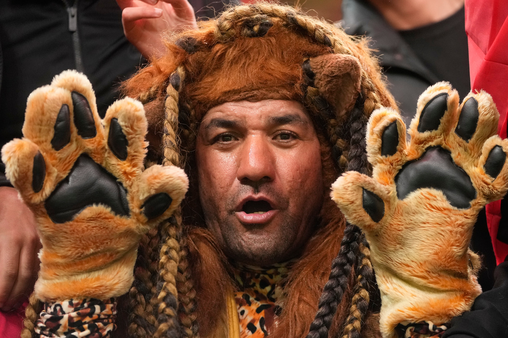 A Moroccan fan cheers before the Africa Cup of Nations group A soccer match between Morocco and Comoros in Rabat, Morocco, Sunday, Dec. 21, 2025. (AP Photo/Mosa'ab Elshamy)