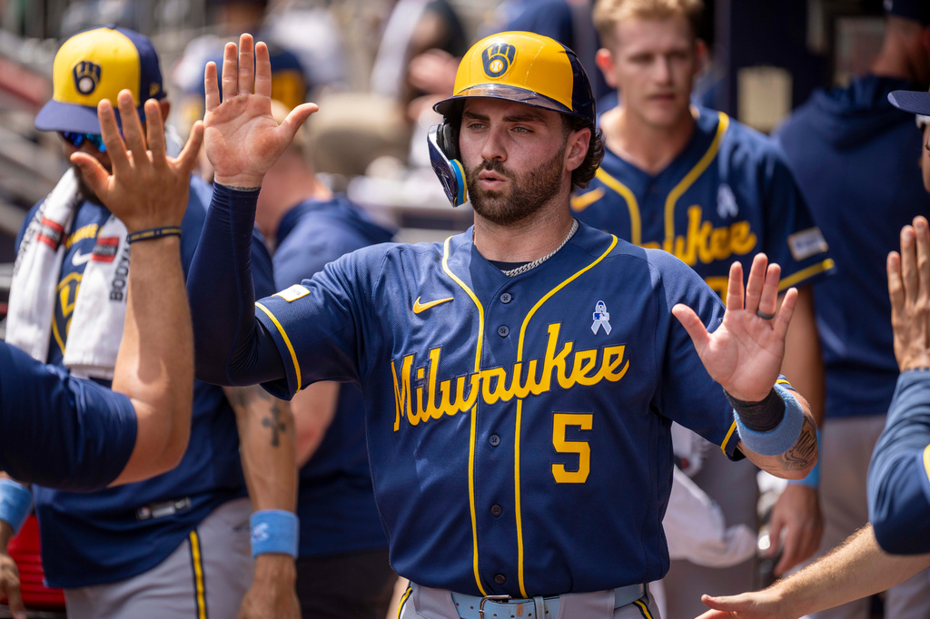 Milwaukee Brewers' Garrett Mitchell (5) celebrates after stealing home during the seventh inning of a baseball game against the Atlanta Braves, Sunday, June 21, 2026, in Atlanta. (AP Photo/Erik Rank)