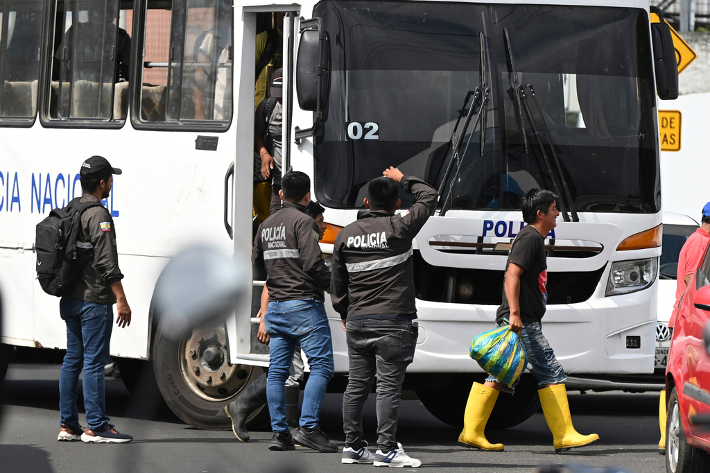Crew members from the boat Maria Candelaria arrive at a police facility in Manta, Ecuador, Monday, Sept. 7, 2026, after being returned to the country following the interception of the vessel by U.S. authorities on suspicion of alleged drug trafficking. (AP Photo/Ariel Ochoa)