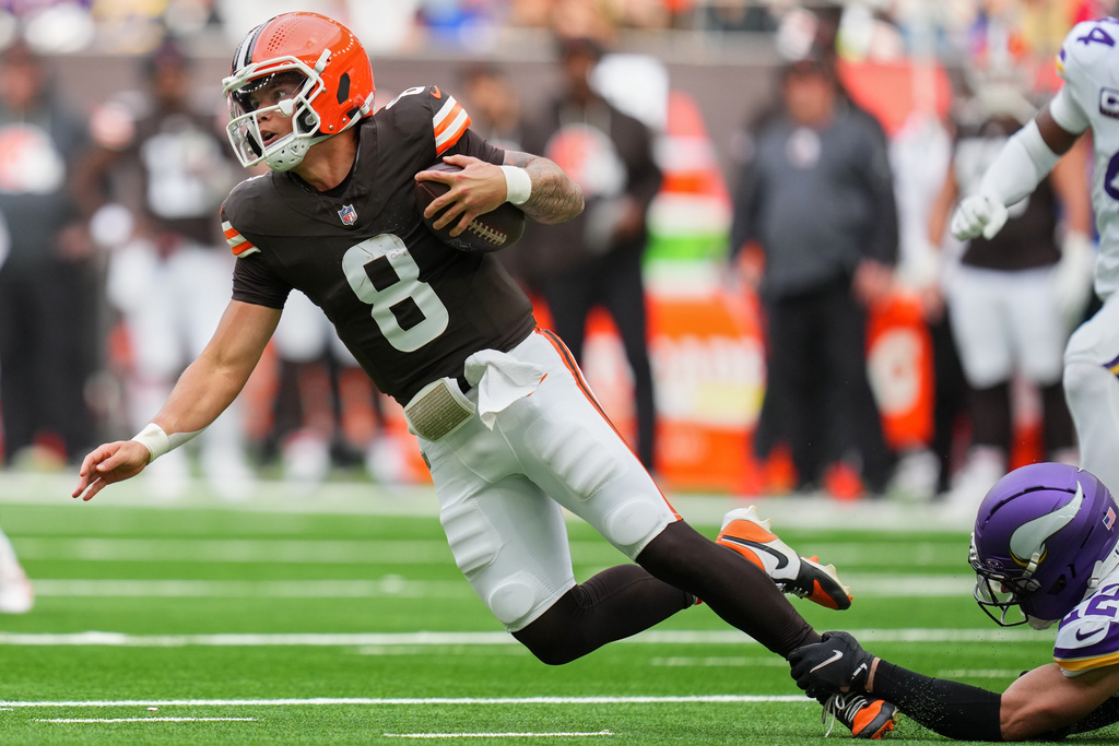 Cleveland Browns quarterback Dillon Gabriel (8) is tackled during the first half of the NFL game between Minnesota Vikings and Cleveland Browns at the Tottenham Hotspur stadium in London, Sunday, Oct. 5, 2025. (AP Photo/Kirsty Wigglesworth)