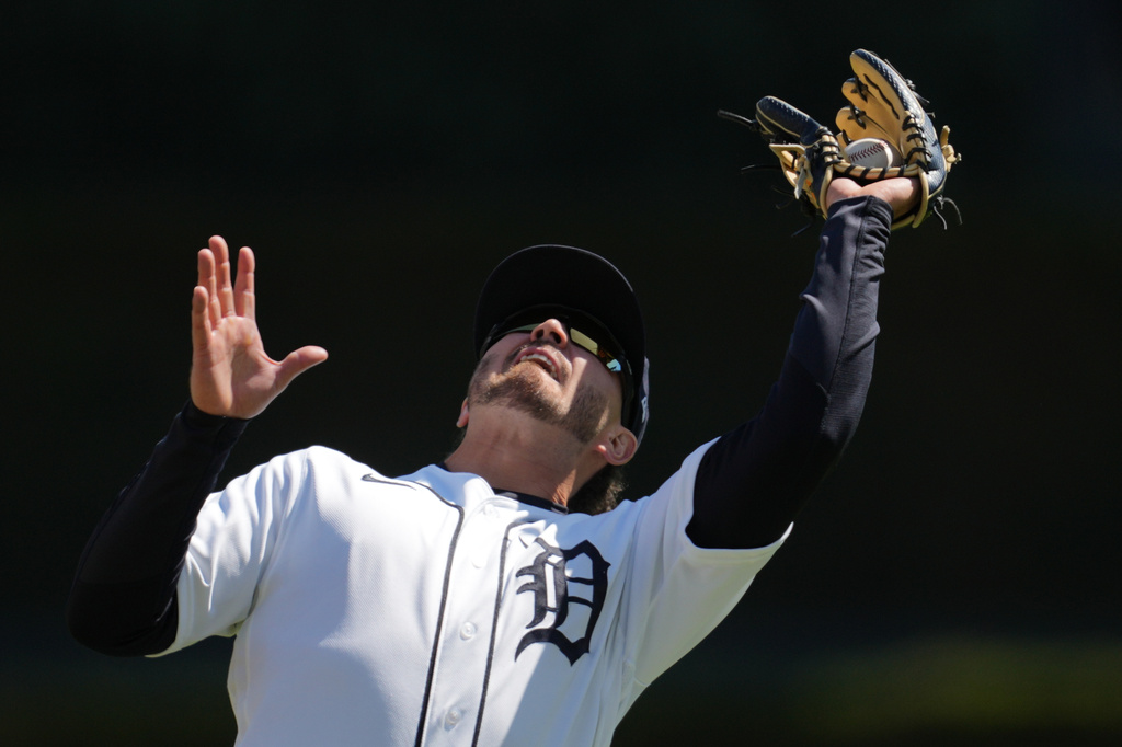 Detroit Tigers second baseman Zach McKinstry catches a Miami Marlins' Agustín Ramírez fly ball during the fifth inning of a baseball game Saturday, April 11, 2026, in Detroit. (AP Photo/Paul Sancya)