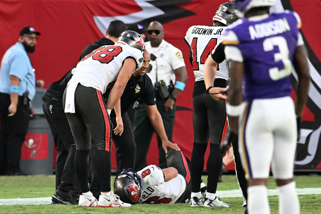 Tampa Bay Buccaneers quarterback Baker Mayfield (6) lays on the ground after sustaining an injury during the second half of an NFL football game against the Minnesota Vikings in Tampa, Fla., Sunday, Sept. 27, 2026. (AP Photo/Jason Behnken)