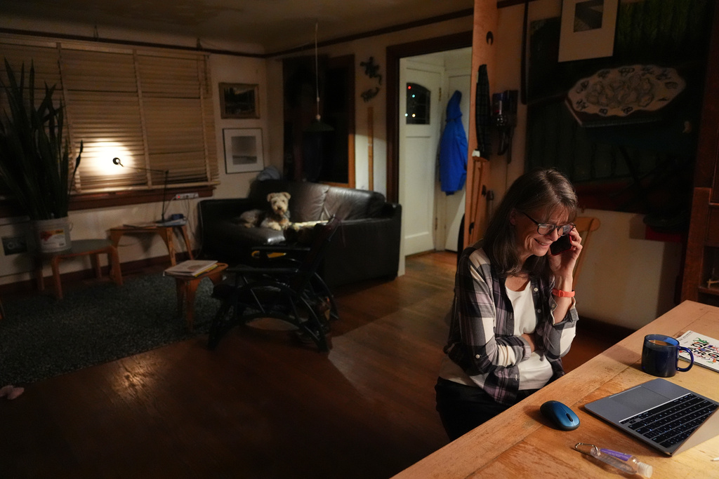 Mary E. Brunkow speaks on the phone with the Nobel committee about winning a Nobel Prize in medicine for part of her work on peripheral immune tolerance, in Seattle, Monday, Oct. 6, 2025. (AP Photo/Lindsey Wasson)