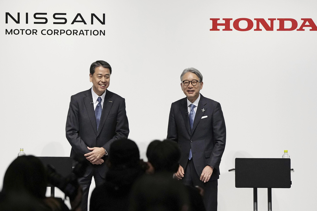 Uncredited FILE - Nissan Chief Executive Makoto Uchida, left, and Honda President Toshihiro Mibe attend a joint news conference in Tokyo, Friday, March 15, 2024. (Kyodo News via AP, File)