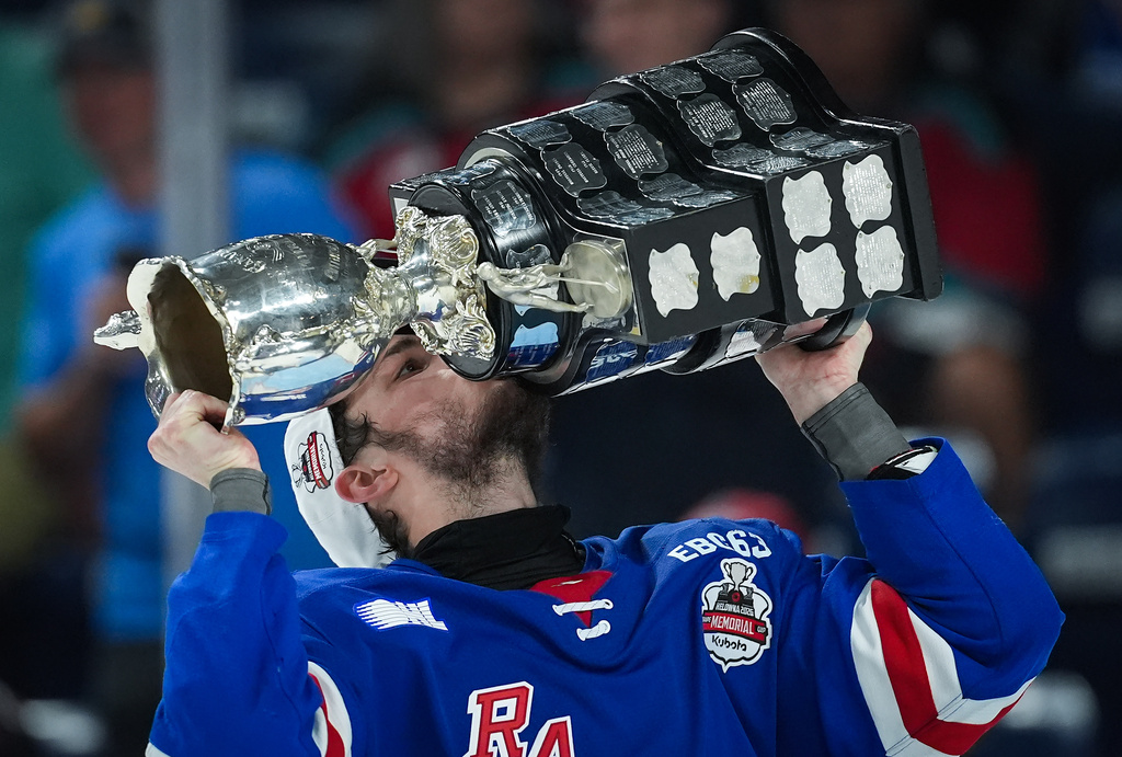 Kitchener Rangers' Christian Humphreys kisses the Memorial Cup after Kitchener defeated the Everett Silvertips to win the Memorial Cup final hockey game in Kelowna, British Columbia, on Sunday, May 31, 2026. (Darryl Dyck/The Canadian Press via AP)
