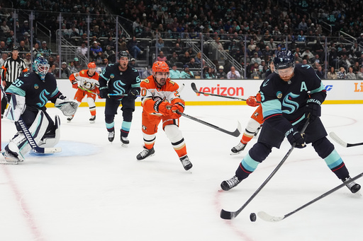 Seattle Kraken defenseman Adam Larsson, far right, moves the puck away from Anaheim Ducks left wing Chris Kreider, second from right, during the second period of an NHL hockey game Thursday, Oct. 9, 2025, in Seattle. (AP Photo/Lindsey Wasson) Seattle Kraken defenseman Adam Larsson, far right, moves the puck away from Anaheim Ducks left wing Chris Kreider, second from right, during the second period of an NHL hockey game Thursday, Oct. 9, 2025, in Seattle. (AP Photo/Lindsey Wasson)