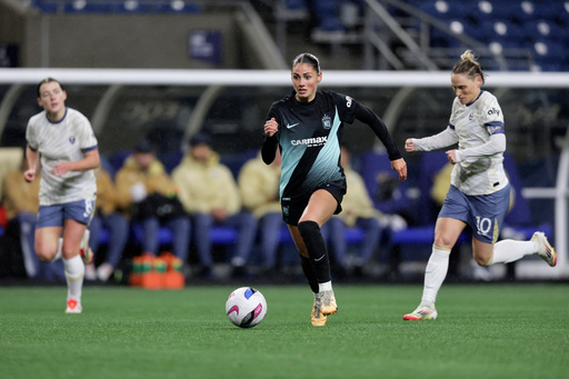 FILE - NJ/NY Gotham FC forward Sarah Schupansky dribbles the ball with Seattle Reign FC midfielder Angharad James-Turner, left, and midfielder Jess Fishlock, right, defending during an NWSL soccer match in Seattle, Saturday, March 15, 2025. (AP Photo/John Froschauer,File) FILE - NJ/NY Gotham FC forward Sarah Schupansky dribbles the ball with Seattle Reign FC midfielder Angharad James-Turner, left, and midfielder Jess Fishlock, right, defending during an NWSL soccer match in Seattle, Saturday, March 15, 2025. (AP Photo/John Froschauer,File)