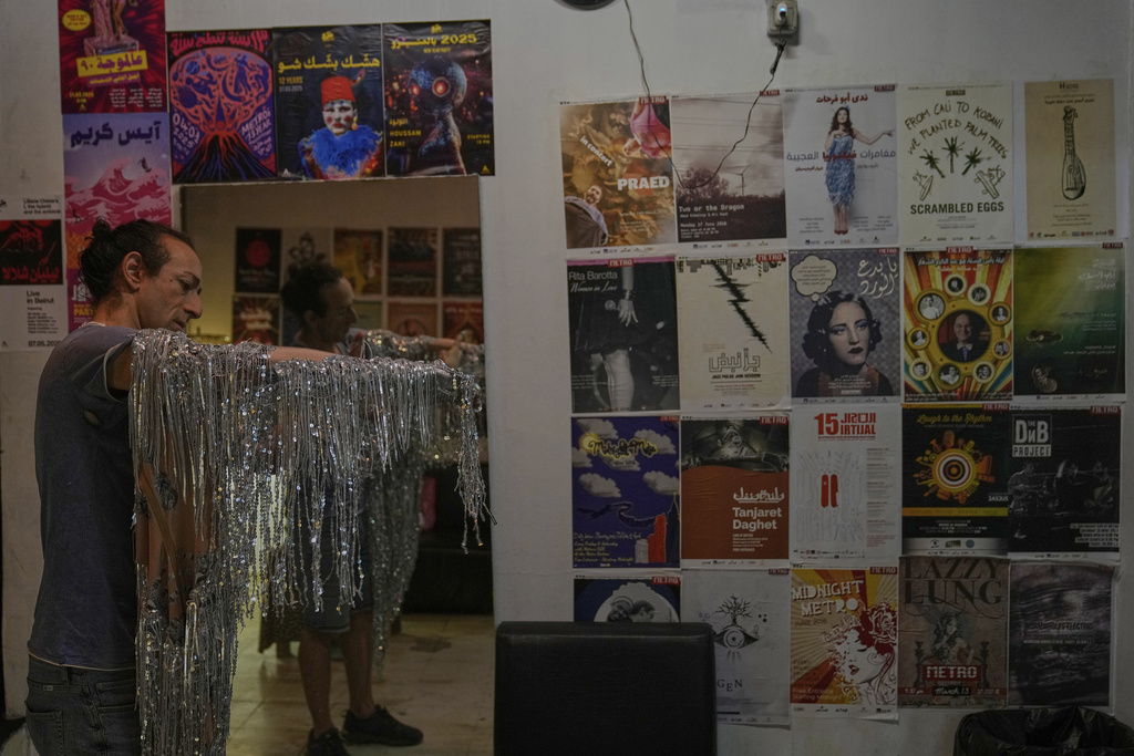 Alexandre Paulikevitch prepares his dress backstage before performing at a theatre in Beirut, Lebanon, Thursday, Sept. 11, 2025. (AP Photo/Hussein Malla)