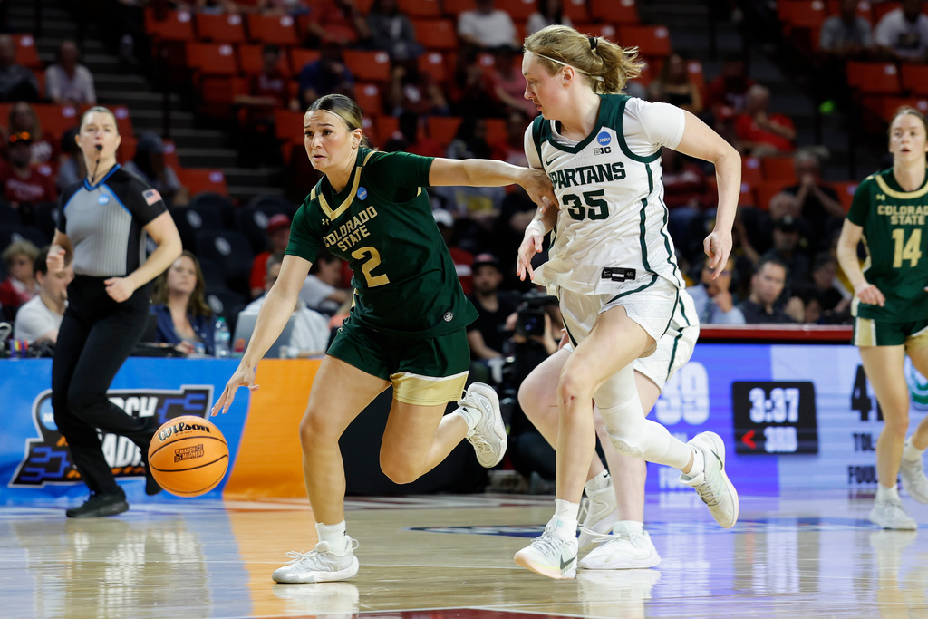 Colorado State guard Brooke Carlson (2) drives to the basket against Michigan State guard Kennedy Blair (35) during the second half in the first round of the NCAA college basketball tournament Friday, March 20, 2026, Norman, Okla. (AP Photo/Alonzo Adams)