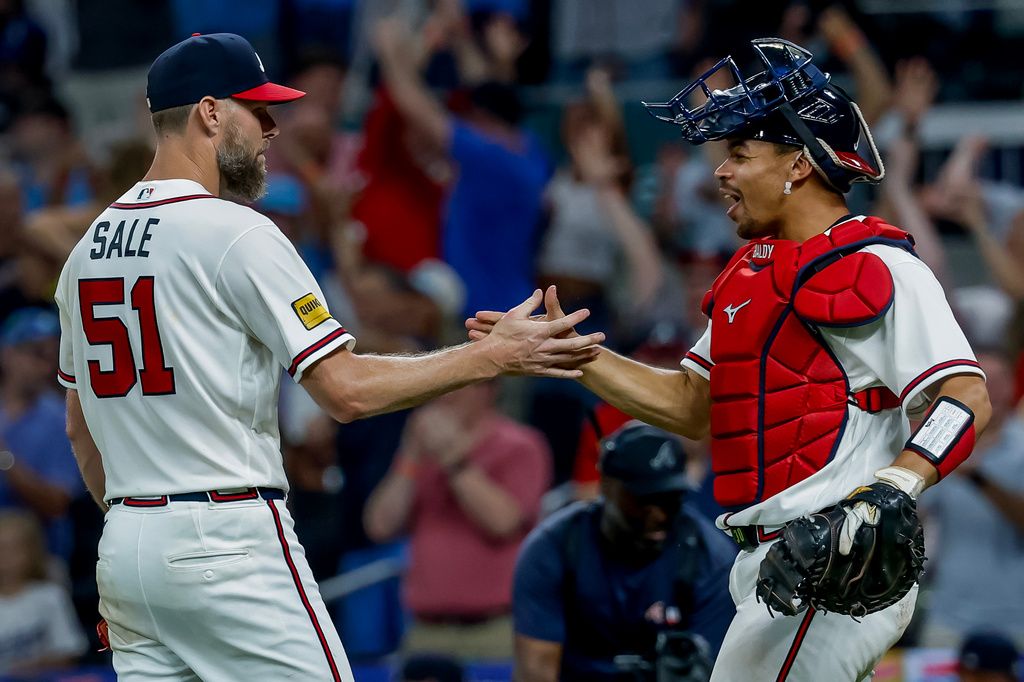 Atlanta Braves pitcher Chris Sale (51) celebrates with catcher Drake Baldwin after Sale won a complete game shutout of the Los Angeles Dodgers during the ninth inning of a baseball game, Thursday, Aug. 27, 2026, in Atlanta. (AP Photo/Erik S. Lesser)
