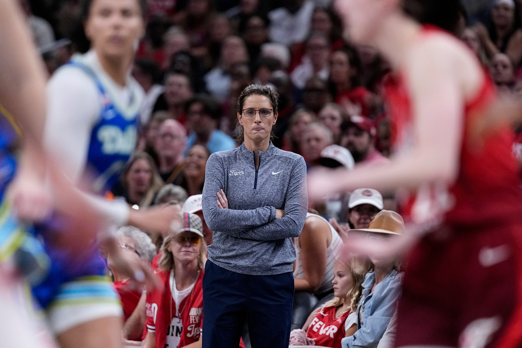 Indiana Fever head coach Stephanie White watches from the sideline in the second half of a WNBA basketball game against the Dallas Wings in Indianapolis, Friday, Aug. 14, 2026. (AP Photo/Michael Conroy)