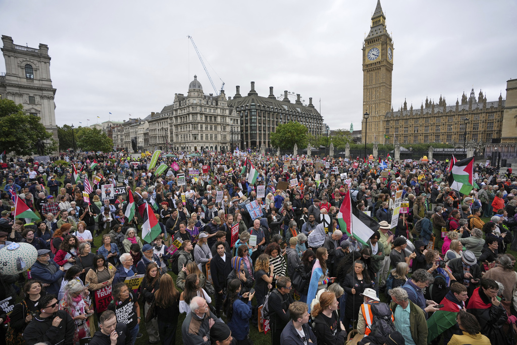 Protesters meet in Parliament Square during a demonstration of the Stop Trump Coalition group against President Donald Trump's state visit in London, Wednesday, Sept. 17, 2025.(AP Photo/Kin Cheung)
