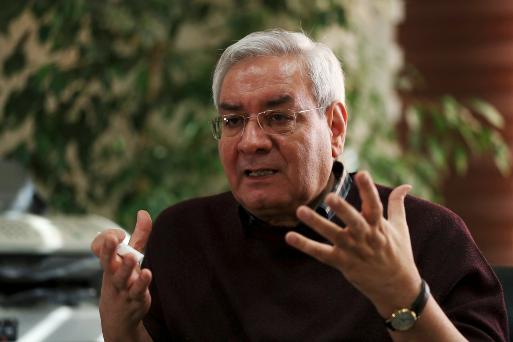 FILE - Ebrahim Asgharzadeh, one of the Iranian student leaders of the 1979 U.S. Embassy takeover, speaks in an interview with The Associated Press in Tehran, Iran, on Oct. 29, 2019. (AP Photo/Vahid Salemi, File)