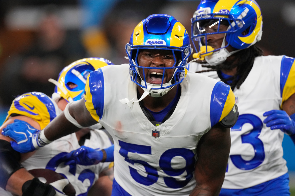 Los Angeles Rams linebacker Darryl Peterson III, right, celebrates after a sack during the second half of an NFL preseason football game against the Los Angeles Chargers Thursday, Aug. 27, 2026, in Inglewood, Calif. (AP Photo/Mark J. Terrill)