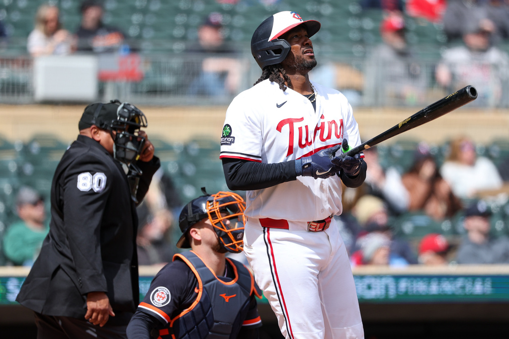 Minnesota Twins' Josh Bell watches his a solo home run during the fourth inning of baseball game against the Detroit Tigers , Thursday, April 9, 2026, in Minneapolis. (AP Photo/Matt Krohn)