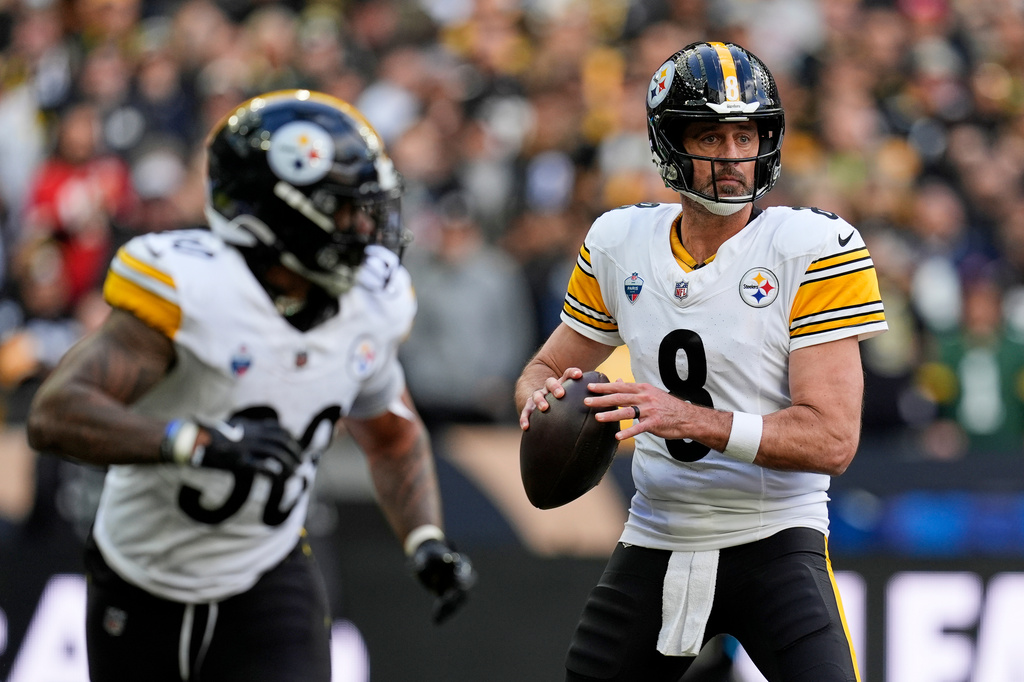 Pittsburgh Steelers quarterback Aaron Rodgers (8) looks to pass during an NFL football game against New Orleans Saints in Saint-Denis, outside Paris, Sunday, Oct. 25, 2026. (AP Photo/Steve Luciano)