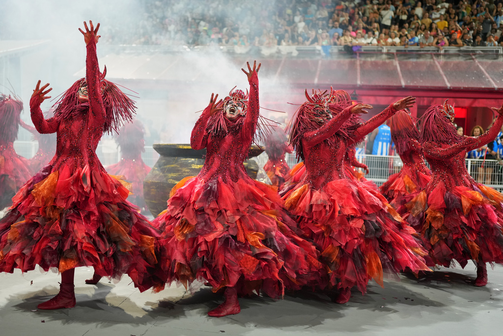 Dancers from the Colorado do Bras samba school perform during a carnival parade in Sao Paulo, Saturday, Feb. 14, 2026. (AP Photo/Andre Penner)