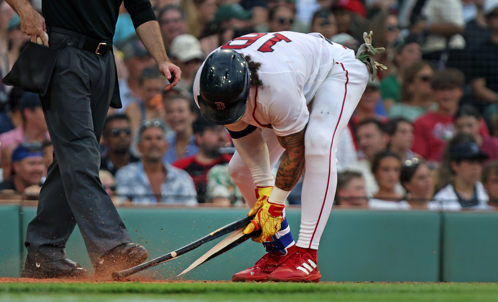 Boston Red Sox's Jarren Duran snaps his bat after striking out to end the eighth inning of a baseball game against the Athletics, Saturday, Aug. 8, 2026, in Boston. (AP Photo/Jim Davis)