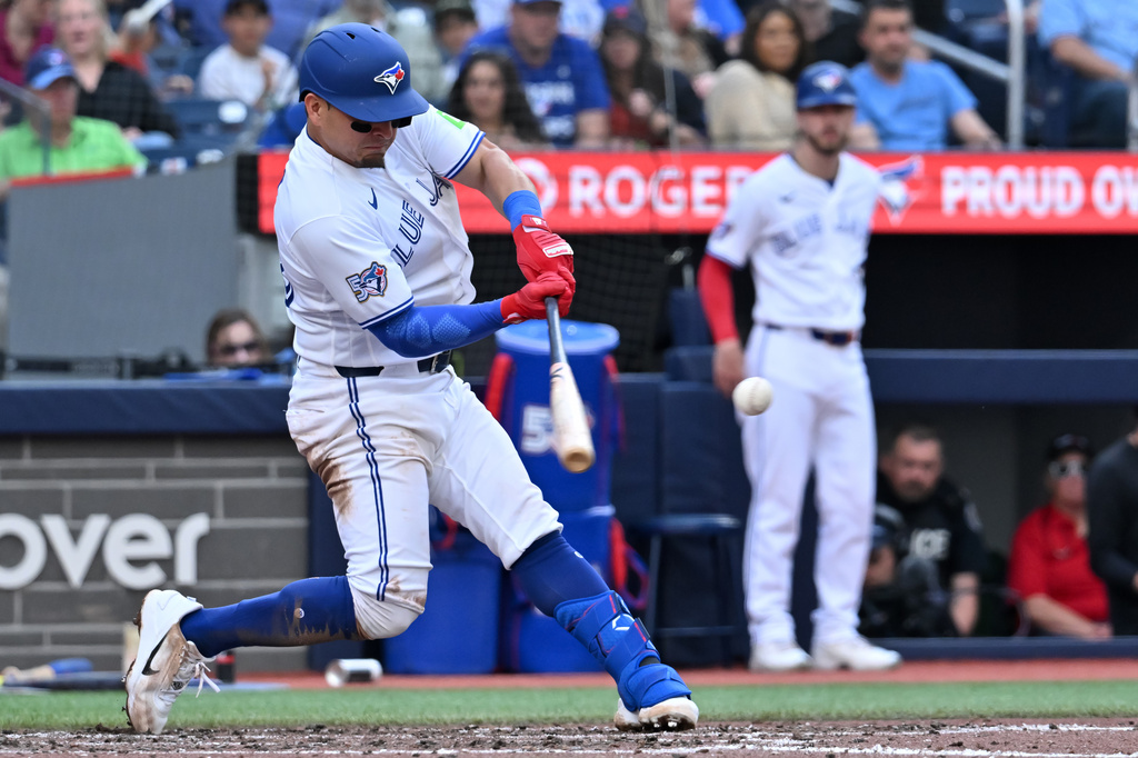 Toronto Blue Jays' Luis Urias (48) hits a two-run home run against the Houston Astros during the fourth inning of a baseball game in Toronto on Tuesday June 23, 2026. (Jon Blacker/The Canadian Press via AP)