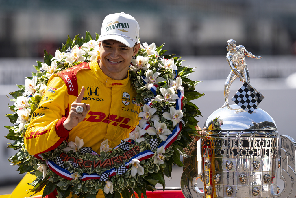 FILE - Indianapolis 500 champion Alex Palou, of Spain, poses with the Borg-Warner Trophy during the traditional winners photo session at Indianapolis Motor Speedway in Indianapolis, Monday, May 26, 2025. (AP Photo/Michael Conroy, file)