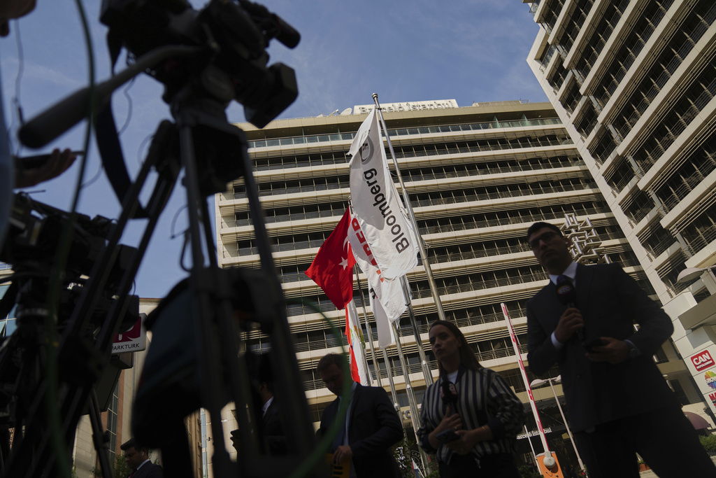 Journalists work outside Haberturk and ShowTv news broadcasters offices, both part of Turkish Can Holding media group, in Istanbul, Turkey, Thursday, Sept. 11, 2025. (AP Photo/Francisco Seco)