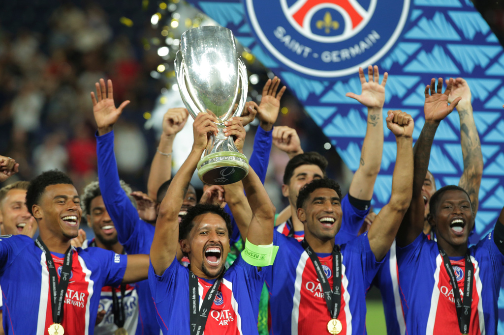 PSG's players lift the trophy during celebrations at the end of the UEFA Super Cup soccer match between Paris Saint-Germain and Aston Villa in Salzburg, Austria, Wednesday, Aug.12, 2026. (AP Photo/Heinz-Peter Bader)
