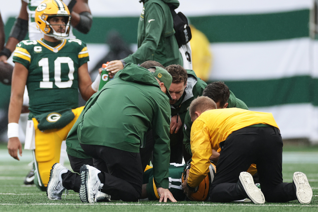 Green Bay Packers wide receiver Jayden Reed (11) is tended to on the field during an NFL football game against the New York Jets in East Rutherford, N.J., Sunday, Sept. 20, 2026. (AP Photo/Adam Hunger)