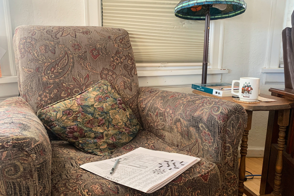 This photo provided by Colleen Elliott shows a completed Montana Standard crossword sitting on a chair in Elliott's home, Saturday, Oct. 18, 2025, in Butte, Mont. (Colleen Elliott via AP)