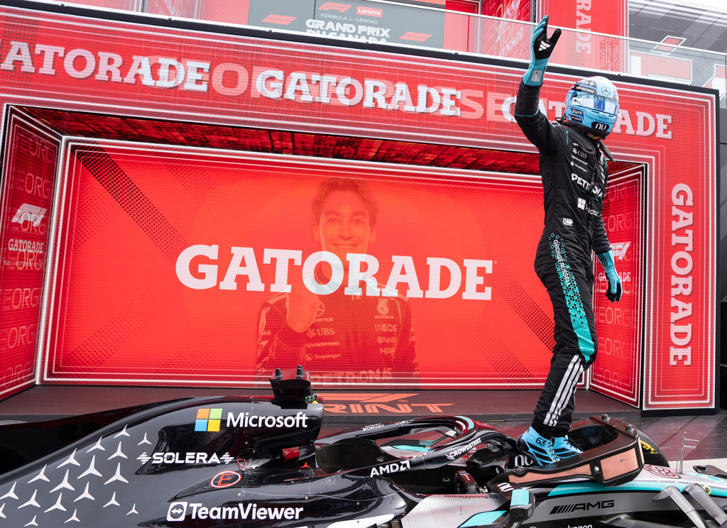 Mercedes driver George Russell, of Britain, waves after winning the sprint race at the F1 Canadian Grand Prix auto race in Montreal, Saturday, May 23, 2026. (Christinne Muschi/The Canadian Press via AP)