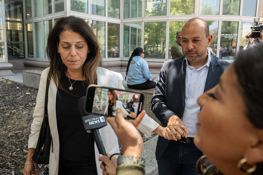 FILE - Nancy Iskander, left, holding the hand of her husband, Karim, leaves Van Nuys Courthouse June 10, 2024, in Van Nuys, Calif., after attending the sentencing hearing in the murder trial of Rebecca Grossman, who is charged in the deaths of their two sons, Mark, 11, and Jacob, 8. (AP Photo/Damian Dovarganes, File)