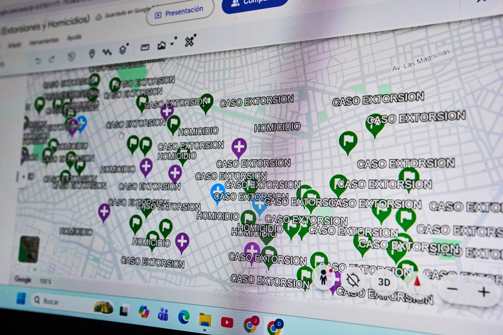 A map showing cases of extortion and murder in the La Esperanza district is displayed on the computer of an investigative police officer in Trujillo, Peru, Monday, May 18, 2026. (AP Photo/Rodrigo Abd)
