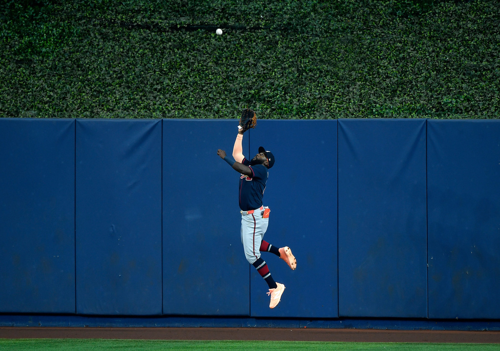 Atlanta Braves center fielder Michael Harris II catches a fly ball hit by Miami Marlins' Heriberto Hernández, not pictured, during the first inning of a baseball game, Wednesday, May 20, 2026, in Miami. (AP Photo/Michael Laughlin)